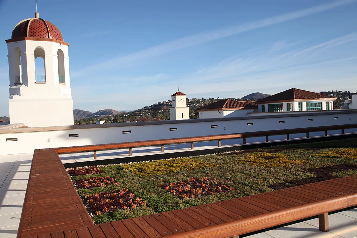 Green living roof surrounded by bench seating on a rooftop in San Diego, California.