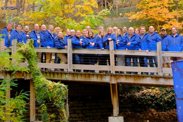 LiveRoof Grower Network standing on a wood bridge at John Ball Zoo